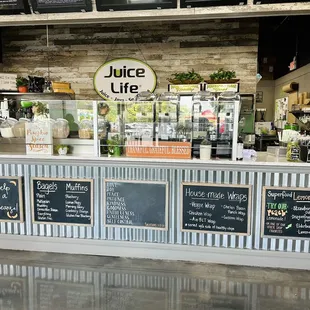 a counter with chalkboard menus