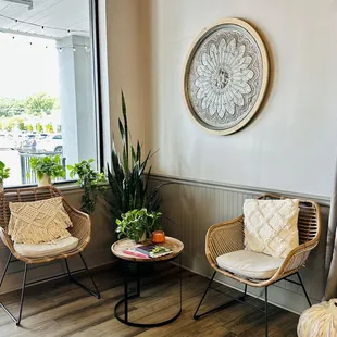 two wicker chairs and a coffee table