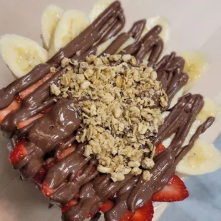 1/2 Green 1/2 Acai base smoothie bowl with Nutella, granola, banana, strawberry