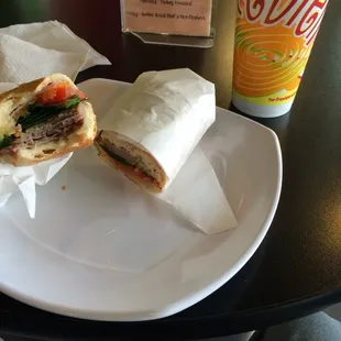 a sandwich and a drink on a table