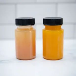two jars of orange juice