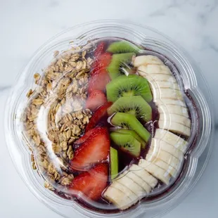 a bowl of fruit and granola