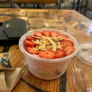 a yogurt with strawberries and almonds