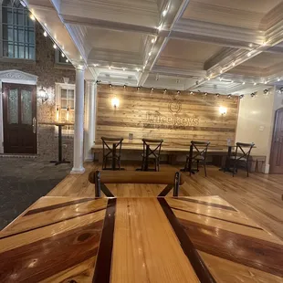 a wooden table and benches in a restaurant