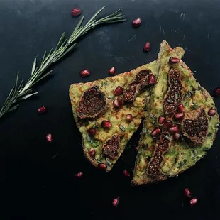 Avocado toast with rosemary, fig and pomegranate.