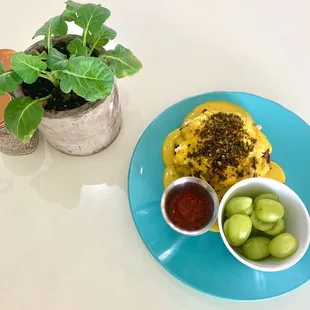 Benedict with side of grapes. Also came with a side of salsa