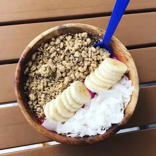 Pitaya bowl with coconut, granola bar and banana