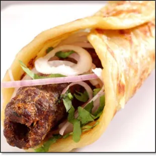 a wrap with meat and onions