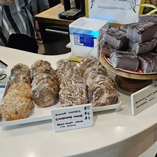 Baked goods next to the register.