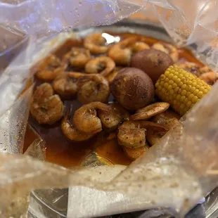 shrimp, corn, and potatoes on a plate