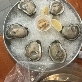 a platter of oysters on ice