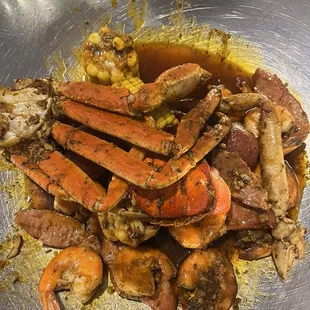 Combo C (1/2 lb crab legs, 1/2 lb shrimp (heads off), 1 lobster tail, 2 corn cobs, 2 red potatoes, and sausage); Cajun/Medium Spicy