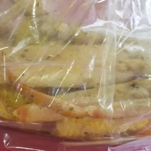 Crab legs in garlic butter seasoning.