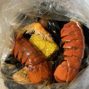 Juicy King Crab Specialty ($57.99) - comes with 1lb Shrimp Head On, 2 pc Lobster Tail, 1lb Black Mussels, 3 Corns, 3 Potatoes