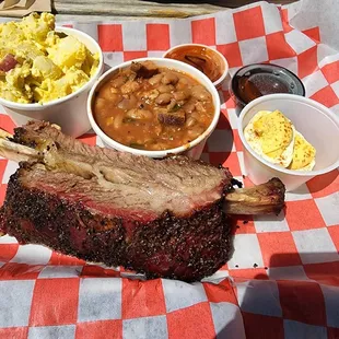 Beef ribs with deviled egg, beans and potato salad.