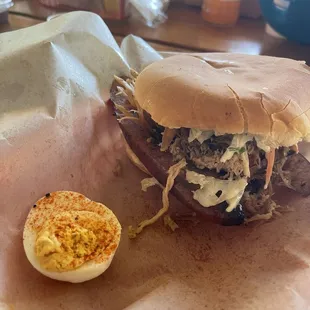 Pulled pork-sausage sandwich with Jalapeno coleslaw