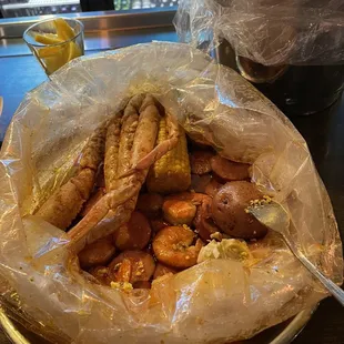 Crab legs, shrimp, sausage, potato, &amp; egg