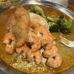 Catfish, and shrimp with no head. Cajun and garlic seasoning with broccoli no corn or potato. Side of rice