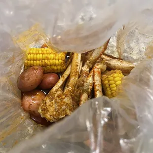 3 Cluster Snow Crab Legs, corn, and potatoes