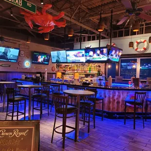 a bar with a lot of tables and chairs