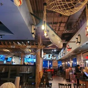 a dining area with tables and chairs