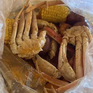 1lb snow crab legs 1/2 lb headless shrimp with corn and potatoes.