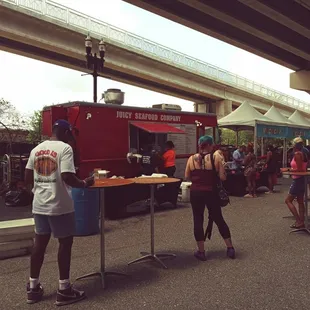 a group of people at a food stand