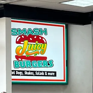a sign for juicy burgers