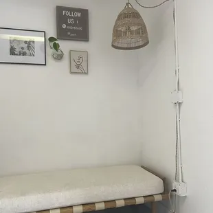 a bench in a white room