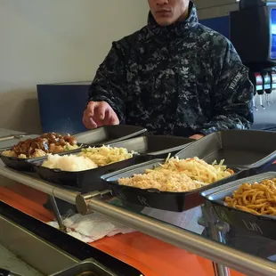 Generous amount of sides waiting to be covered with meat and teriyaki sauce!