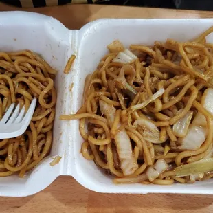 two take out containers of noodles