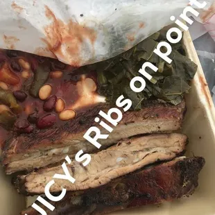 ribs and greens in a styrofoam container