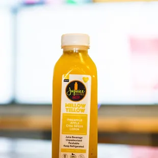 a bottle of jujujuju juice on a table
