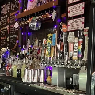 a bar with a variety of drinks