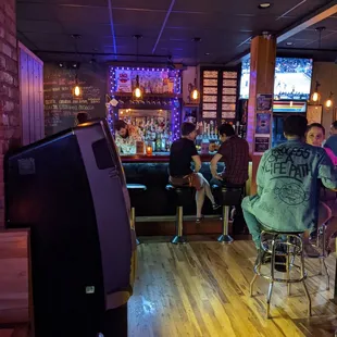 a group of people sitting at a bar