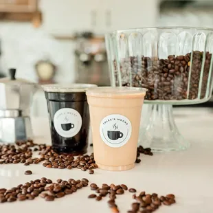 two cups of coffee and coffee beans