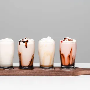 four glasses of milkshakes
