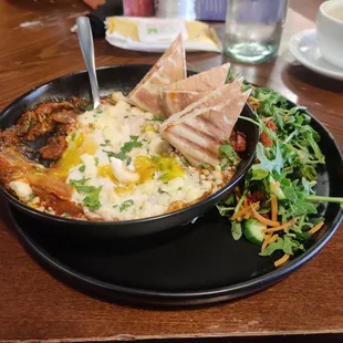 Trying something new today. &quot;Shakshuka&quot; is a stew and it comes with a side salad making it&quot;delightfully different&quot;. It&apos;s pretty good.