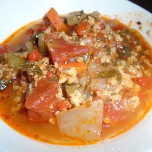 Pepper &amp; sausage soup, close-up.