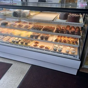 a display case filled with pastries