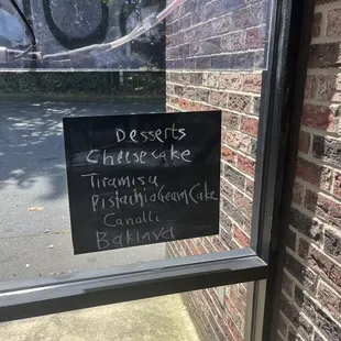 a sign on the window of a restaurant