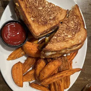 Bandito sandwich - grilled cheese with bbq brisket and sausage, and sweet potato wedges