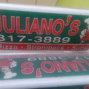 two signs for the restaurant