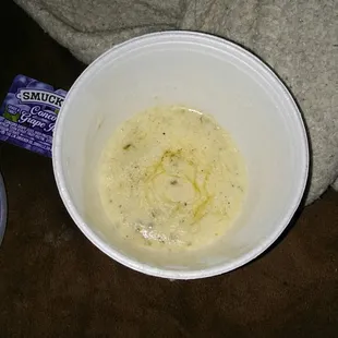 a bowl of mashed potatoes and a cup of yogurt