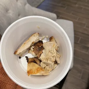 a person holding a plate of food