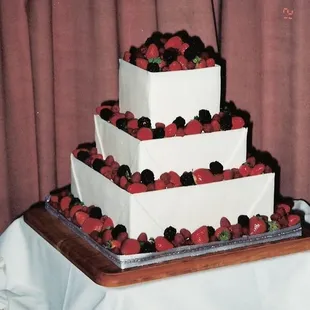 a wedding cake with strawberries