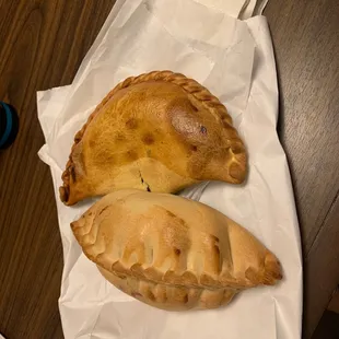 two empanadas on a table