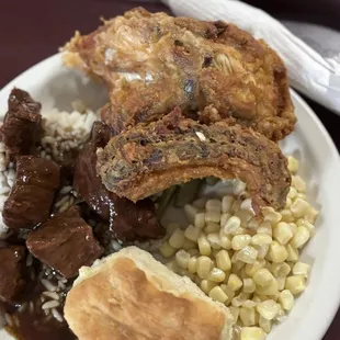 Chicken, corn, beef tips, rice, biscuit