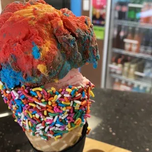 an ice cream cone with sprinkles