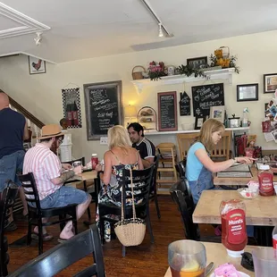 a group of people sitting at tables